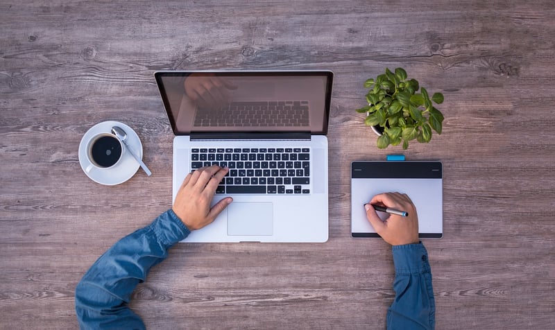 Businessman researching on laptop